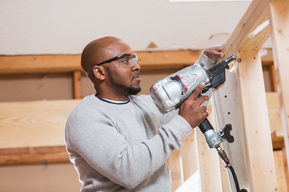 Person holding an air nailer
